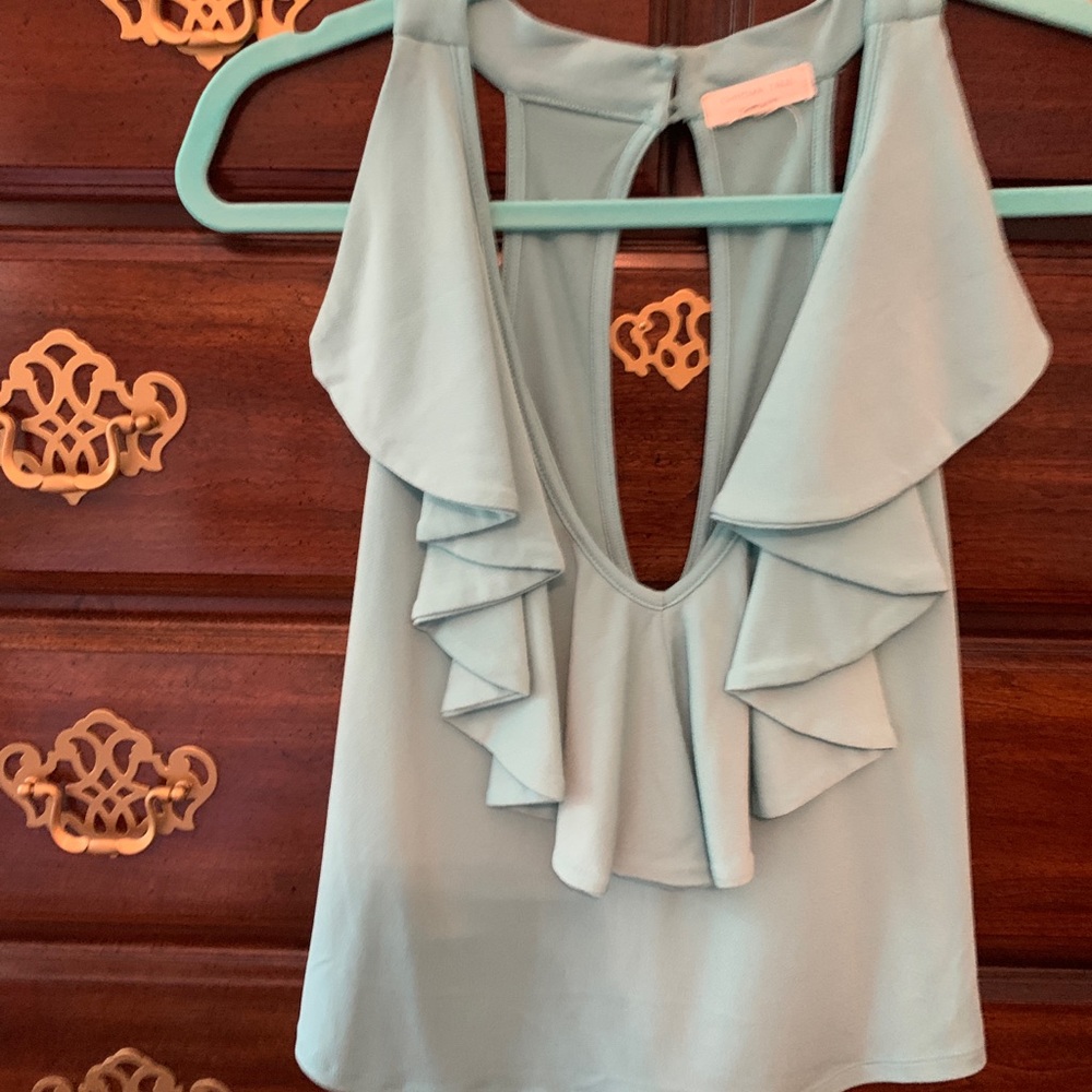 Adorable mint color top.